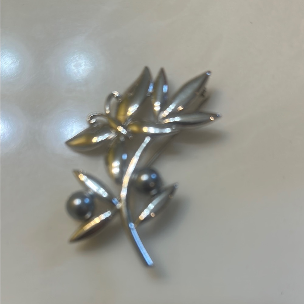 Nina Ricci Elegant Silver Floral Brooch